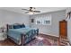Comfortable bedroom with hardwood floors, a ceiling fan, and plenty of natural light at 2010 Dogwood Trl, Shelby, NC 28150