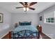 Cozy bedroom with hardwood floors, a ceiling fan, and natural light from the windows at 2010 Dogwood Trl, Shelby, NC 28150