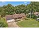 Aerial shot of a well-maintained brick home, showcasing its two-car garage and landscaped front yard at 2010 Dogwood Trl, Shelby, NC 28150