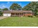 Charming brick home with a two-car garage, lush lawn, and manicured landscaping at 2010 Dogwood Trl, Shelby, NC 28150