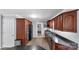 Well-equipped kitchen with stainless steel appliances, granite countertops, and dark wood cabinetry at 2010 Dogwood Trl, Shelby, NC 28150