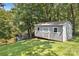 Charming shed on a lush, wooded lot by the lake, perfect for storage or hobbies at 2010 Dogwood Trl, Shelby, NC 28150