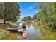 Picturesque waterfront view with a private dock and boats, surrounded by trees at 2010 Dogwood Trl, Shelby, NC 28150