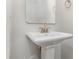 Elegant pedestal sink with modern fixtures and a clean, minimalist design at 2039 Sadler Woods Ln, Charlotte, NC 28214