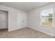 Carpeted bedroom with natural light and standard closet with double doors at 2039 Sadler Woods Ln, Charlotte, NC 28214