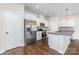 Stylish kitchen featuring stainless steel appliances, white cabinetry, and a large refrigerator at 2039 Sadler Woods Ln, Charlotte, NC 28214