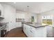 Modern kitchen with white cabinets, granite countertops, stainless appliances and island at 2039 Sadler Woods Ln, Charlotte, NC 28214