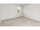 Bedroom featuring carpet floor and a window allowing ample sunlight at 2047 Sadler Woods Ln, Charlotte, NC 28214