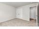 Bedroom featuring carpet floor, closet and access to a bathroom through a door at 2047 Sadler Woods Ln, Charlotte, NC 28214