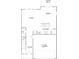 A detailed first-floor floor plan illustrating the layout of the home, including the kitchen, living, and garage at 2047 Sadler Woods Ln, Charlotte, NC 28214