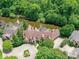 Aerial view of an estate with a pond and manicured grounds at 2240 La Maison Dr, Charlotte, NC 28226