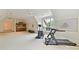 Spacious bonus room with gym equipment, kitchenette, and a large window at 2240 La Maison Dr, Charlotte, NC 28226