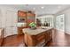 Gourmet kitchen island with granite countertops, stainless steel sink, and custom cabinets at 2240 La Maison Dr, Charlotte, NC 28226