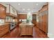 Spacious kitchen with custom cabinets, granite countertops, and a large center island at 2240 La Maison Dr, Charlotte, NC 28226
