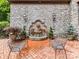 Beautiful stone courtyard with a lion's head fountain and elegant seating at 2240 La Maison Dr, Charlotte, NC 28226