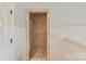 Elegant bathroom shower featuring beige tiling and a glass door at 2240 La Maison Dr, Charlotte, NC 28226