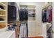Spacious walk-in closet with custom storage solutions, shelving, and hanging racks for clothing at 2240 La Maison Dr, Charlotte, NC 28226