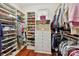 Well-organized walk-in closet with custom shelving, drawers, and ample storage space at 2240 La Maison Dr, Charlotte, NC 28226