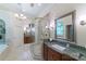 Luxurious bathroom with walk-in shower, double vanity, and tub with tile surround at 2314 Winding Oaks Trl, Waxhaw, NC 28173