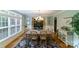 Elegant dining room featuring a large window for natural light and a stylish chandelier above the table at 2314 Winding Oaks Trl, Waxhaw, NC 28173