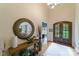 Grand foyer featuring a high ceiling, beautiful hardwood floors, and elegant double doors at 2314 Winding Oaks Trl, Waxhaw, NC 28173
