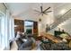 Spacious living room with a fireplace, built-in shelving, and a staircase leading to the upper level at 2314 Winding Oaks Trl, Waxhaw, NC 28173