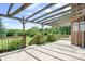 Wooden deck with pergola and lush green scenery, perfect for outdoor entertaining and relaxation at 24008 Carriker Rd, Albemarle, NC 28001