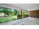 Covered back porch featuring brick columns and ample space for outdoor seating and entertainment at 24008 Carriker Rd, Albemarle, NC 28001
