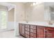 Bathroom featuring double sink vanity with wood cabinets and tile flooring at 24008 Carriker Rd, Albemarle, NC 28001