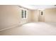 Bedroom with carpet flooring, neutral walls, and two windows at 24008 Carriker Rd, Albemarle, NC 28001