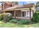 Spacious covered patio with brick pillars, offering an ideal space for outdoor relaxation and entertaining at 24008 Carriker Rd, Albemarle, NC 28001