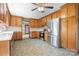 Spacious kitchen featuring wood cabinets, stainless steel appliances, and tile flooring at 24008 Carriker Rd, Albemarle, NC 28001