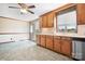Bright kitchen featuring ample wood cabinets, tile backsplash, and stainless steel appliances at 24008 Carriker Rd, Albemarle, NC 28001