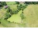A picturesque pond is nestled within the property's natural landscape at 24008 Carriker Rd, Albemarle, NC 28001