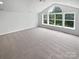 Large bedroom with vaulted ceiling, lots of natural light, and neutral carpet at 2479 N Legacy Park Blvd, Fort Mill, SC 29707