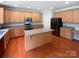 Well-equipped kitchen with custom cabinetry, stainless steel appliances, and a center island at 2479 N Legacy Park Blvd, Fort Mill, SC 29707