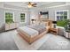Spacious main bedroom with large windows, soft lighting, and neutral decor at 2479 N Legacy Park Blvd, Fort Mill, SC 29707