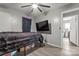 Bedroom with wood-look floors, grey walls, a ceiling fan, and a large TV at 301 Honeywood Ave, Charlotte, NC 28216