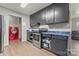 A view of the kitchen featuring stainless steel appliances and ample cabinet space at 301 Honeywood Ave, Charlotte, NC 28216