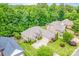 Beautiful aerial shot of a brick home with mature landscaping, a spacious driveway, and a well-maintained lawn at 305 River Birch Cir, Mooresville, NC 28115