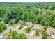Expansive aerial view of a neighborhood with mature trees and well-maintained homes at 305 River Birch Cir, Mooresville, NC 28115