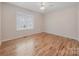 Bedroom featuring hardwood floors, natural lighting, and a ceiling fan at 305 River Birch Cir, Mooresville, NC 28115