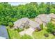 Beautiful brick home with a well-manicured lawn, mature trees, and ample parking space at 305 River Birch Cir, Mooresville, NC 28115