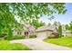 Lovely brick home featuring a two-car garage and lush greenery enhancing its curb appeal at 305 River Birch Cir, Mooresville, NC 28115