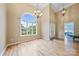 Elegant foyer featuring hardwood floors, tall ceilings, chandelier, and natural light at 305 River Birch Cir, Mooresville, NC 28115