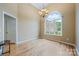 Spacious foyer with hardwood floors, high ceilings, and natural light streaming through the arched window at 305 River Birch Cir, Mooresville, NC 28115