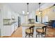 Spacious kitchen with granite countertops, stainless steel appliances, and seating at the bar at 305 River Birch Cir, Mooresville, NC 28115