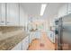 Bright kitchen featuring granite countertops, stainless steel appliances, and lots of cabinet space at 305 River Birch Cir, Mooresville, NC 28115