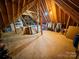 Unfinished attic space offering potential for extra storage or future expansion, featuring exposed beams at 3273 16Th Ne St, Hickory, NC 28601