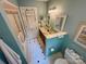 Well-lit bathroom with a walk-in shower, vanity, and colorful decor at 3273 16Th Ne St, Hickory, NC 28601